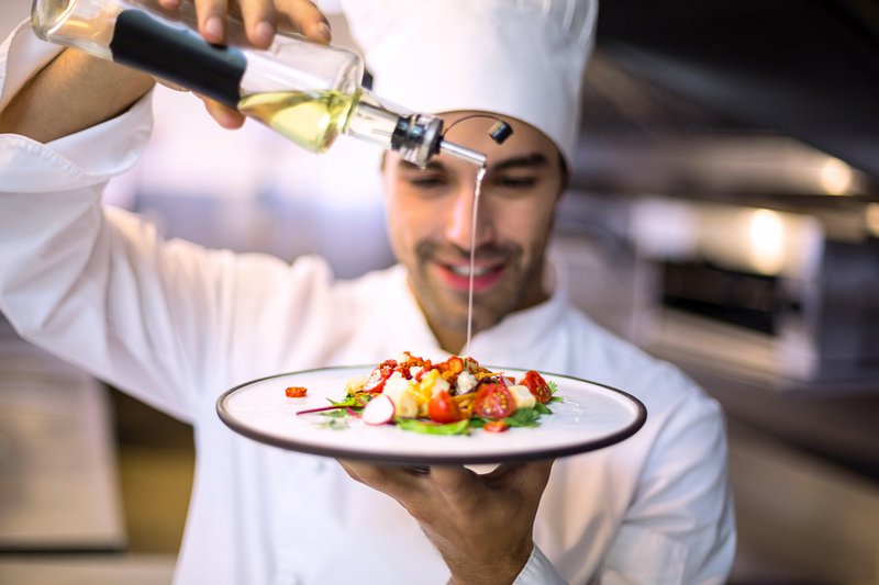 hd_chef-pouring-olive-oil-on-meal_1575627798.jpg